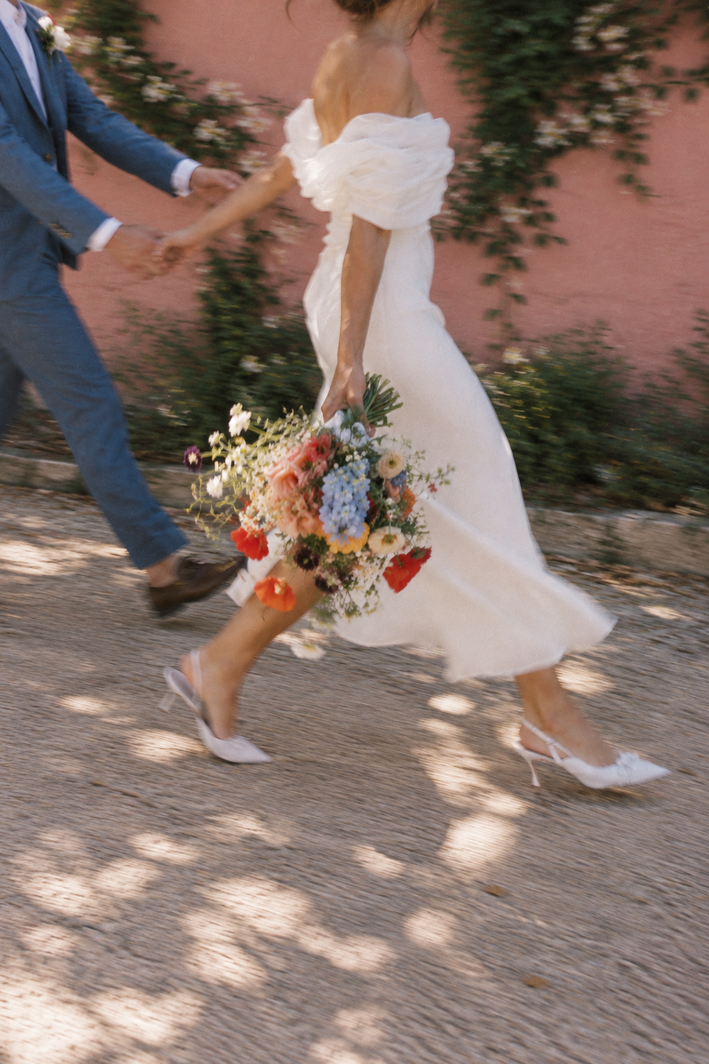 Bride walking with her wedding bouquet